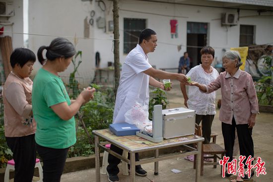 中国青年报|在蓄洪区 等洪水退去